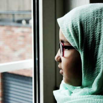 Girl Looking out Window_rachid-oucharia-2qSb8IXIWr0-unsplash
